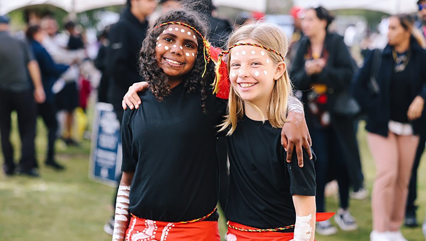 Kids hugging and looking into the camera 
